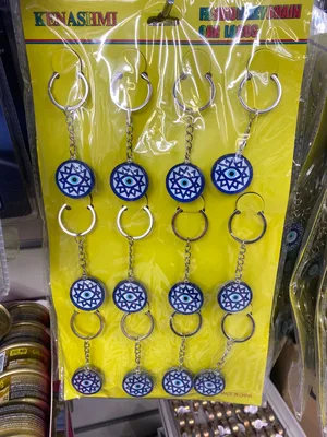 סט סיטונאי 12 יח׳ מחזיקי מפתחות “עין כחולה” בדגם כוכב/מגן דוד – נגד עין הרע