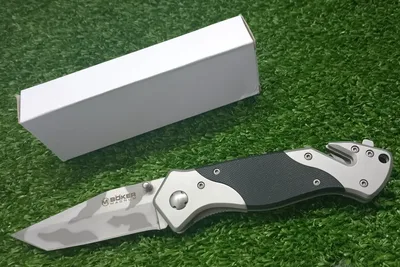 אולר מתקפל BÖKER MAGNUM עם להב בעיצוב הסוואה ואמצעי חילוץ